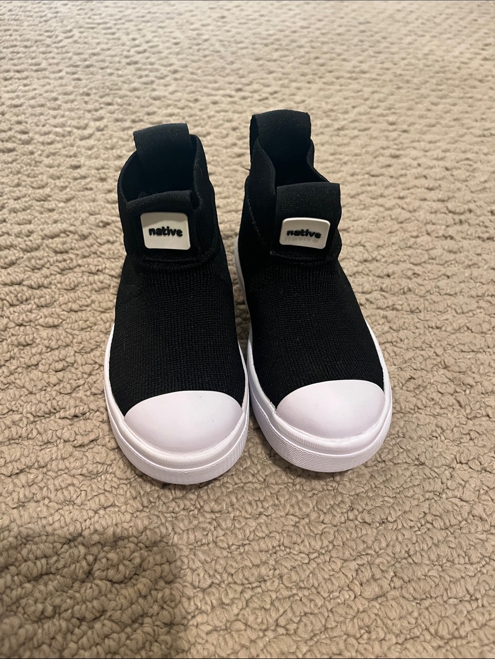 Native Kids Black Slip-On Sneakers with White Toe Cap